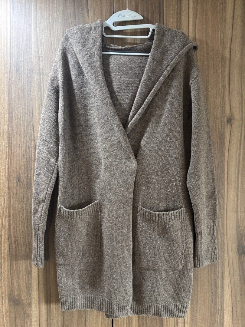 Wool outerwear (Category: Coats, Jackets and Outerwear) located in Singapore. Submitted by taurus15 (Listing ID 1411348113, Image 1). Description: Bought this in Korea during an Autumn trip. Very warm. Free size. Comes with a hood. One hidden button at the front and 2 front pockets. My height is 157cm and this coat is at my knee length. .