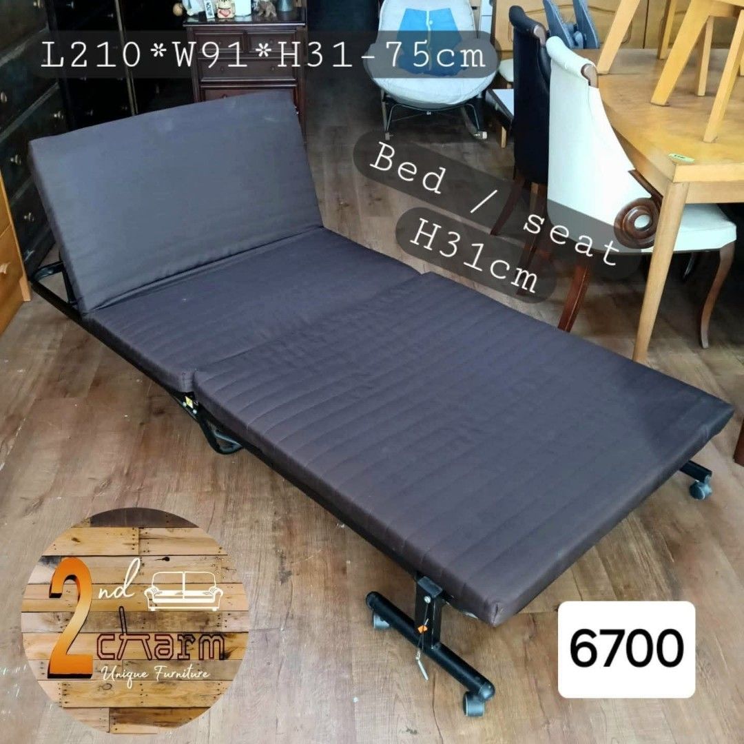 2nd hand Reclining Single Folding Bed (Category: Bed Frames & Mattresses) located in Paranaque City. Submitted by feybelhaft (Listing ID 1411504898, Image 2). Description: Versatile folding bed can be used as a seat or a bed. It has dimensions of L210*W91*H31-75cm when used as a bed and L95*W23*H109cm when folded. The bed is dark brown in color and has a metal frame. It is suitable for small spaces and easy to store..