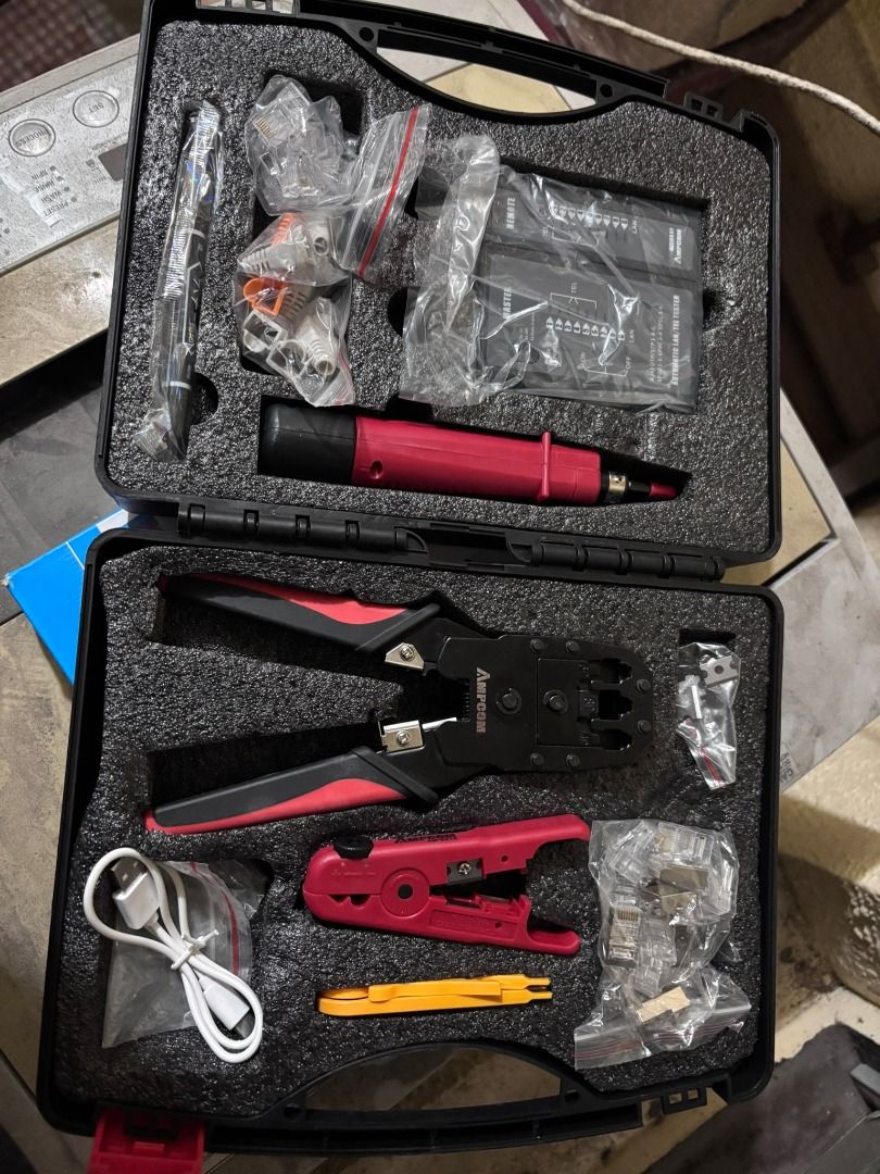 AMPCOM Network Tool Kit / Crimping Tools (Category: Networking) located in Manila. Submitted by hawker_techxx317 (Listing ID 1411512712, Image 1). Description: - Complete AMPCOM network tool kit. - Includes crimping tool, wire stripper, and punch-down tool. - Comes with various connectors. - Convenient black carrying case for storage and transport. - Ideal for professional and DIY network projects. tool for RJ45/RJ11/RJ12 connectors, a network ca