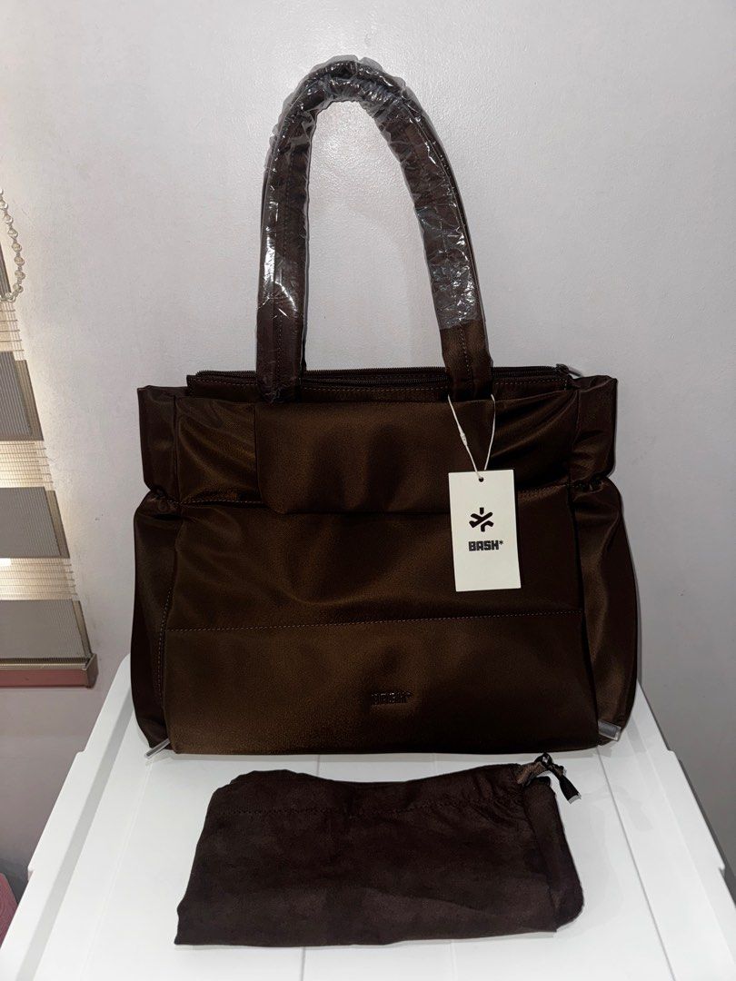 Bash Weekday Tote in Terra (Category: Tote Bags) located in Manila. Submitted by decluterrrr (Listing ID 1411489762, Image 1). Description: - Brand new, rfs is received two of it as a gift - Rich brown color - Spacious interior with multiple compartments - Complete inclusions including dust bag, tag, paper bag - Sturdy handles and sleek design - Features a front pocket and top zipper closure - Perfect for work, travel, or everyday use.