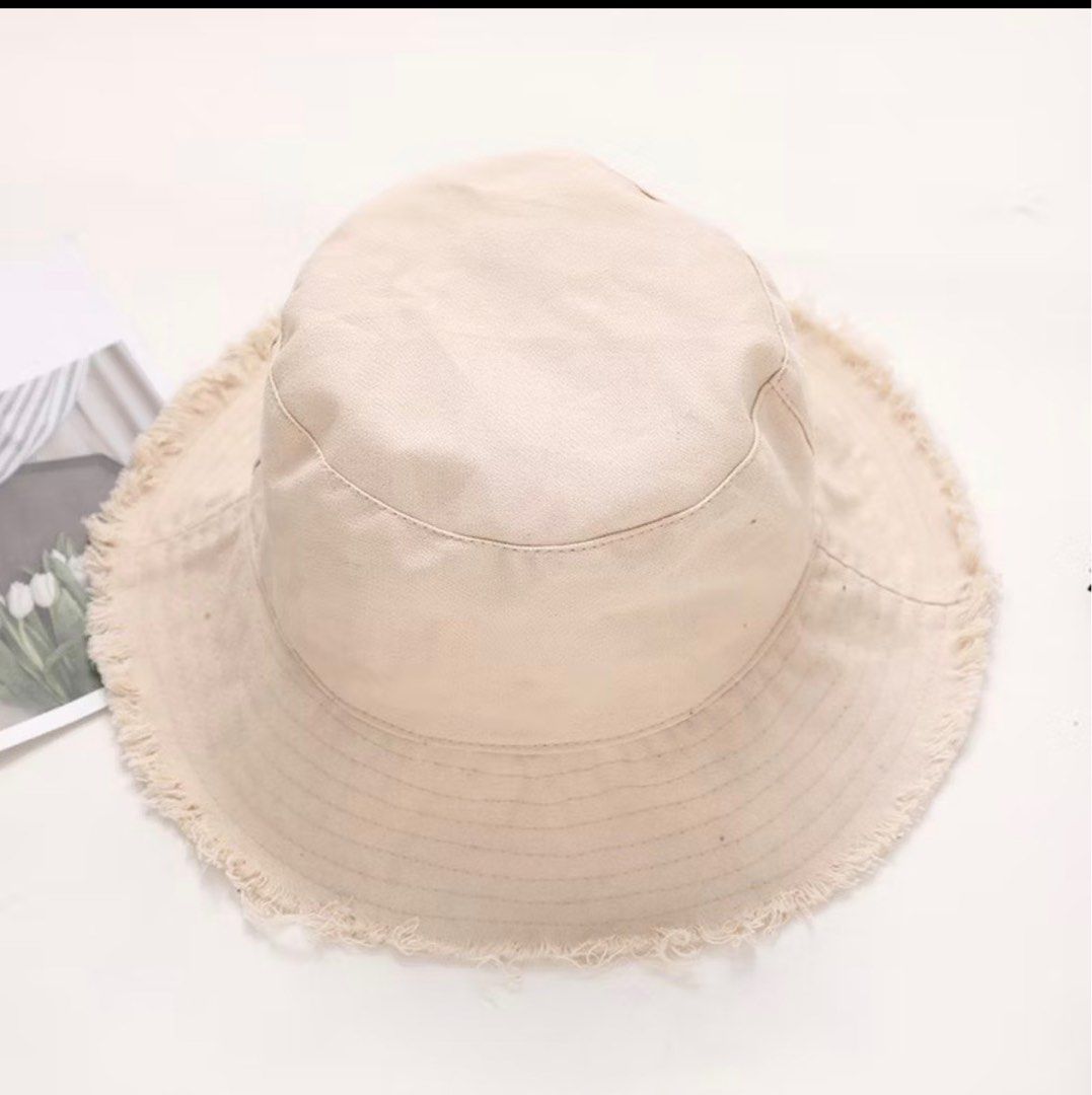 Beige Bucket Hat with Frayed Brim (Category: Hats & Beanies) located in Zamboanga. Submitted by _kaoru (Listing ID 1411569072, Image 1). Description: - Beige bucket hat - Frayed brim - Soft, light-colored fabric - Relaxed fit - Casual style - Versatile accessory [54-60 cm] Spring Summer Basic Fisherman Hat/ Korean Fringe Beach Panama Caps/ Casual Double-sided Bucket Hats/ Outdoor Wide Brim Shade Hats.