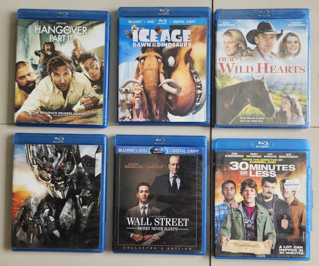 Blu-ray Movie Bundle of 6 (Category: CDs & DVDs) located in Rizal. Submitted by cherry_garcia (Listing ID 1411493922, Image 1). Description: Bundle of Blu-ray movies including "Hangover Part II", "Ice Age: Dawn of the Dinosaurs", "Our Wild Hearts", "Transformers: Revenge of the Fallen", "Wall Street: Money Never Sleeps", and "30 Minutes or Less". All discs are included. Some movies come with a DVD and digital copy..