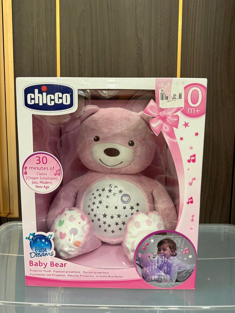 Chicco First Dreams Baby Bear Projector Plush (Category: Plushies & Soft Toys) located in San Juan City. Submitted by ollieque (Listing ID 1411597075, Image 1). Description: - Chicco First Dreams Baby Bear projector plush toy. - Projects stars and dreamy images. - Plays 30 minutes of music: Chopin-Schumann, Jazz, Modern, New Age. - Suitable for newborns and up. - Brand new, in original packaging..
