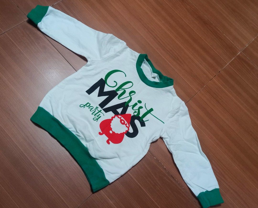 Christmas Party Sweater ( 3-4 yrs old) (Category: Babies & Kids Fashion) located in Las Pinas. Submitted by ejstyles (Listing ID 1411459713, Image 1). Description: - White long-sleeved sweater - Green collar and cuffs - Features "ChristMAS party" text - Santa Claus graphic on front - Used only once.
