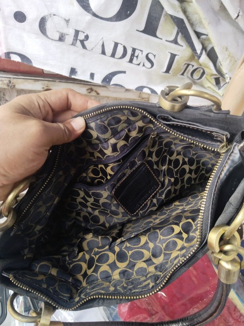 Coach Black Signature Handbag (Category: Luxury Bags & Wallets) located in Paranaque City. Submitted by jayson193 (Listing ID 1411515715, Image 3). Description: - Authentic Coach handbag - Black with signature pattern - Gold-tone hardware - Front pocket - Zip closure - Patterned interior lining - Dual handles - Includes Coach tag.