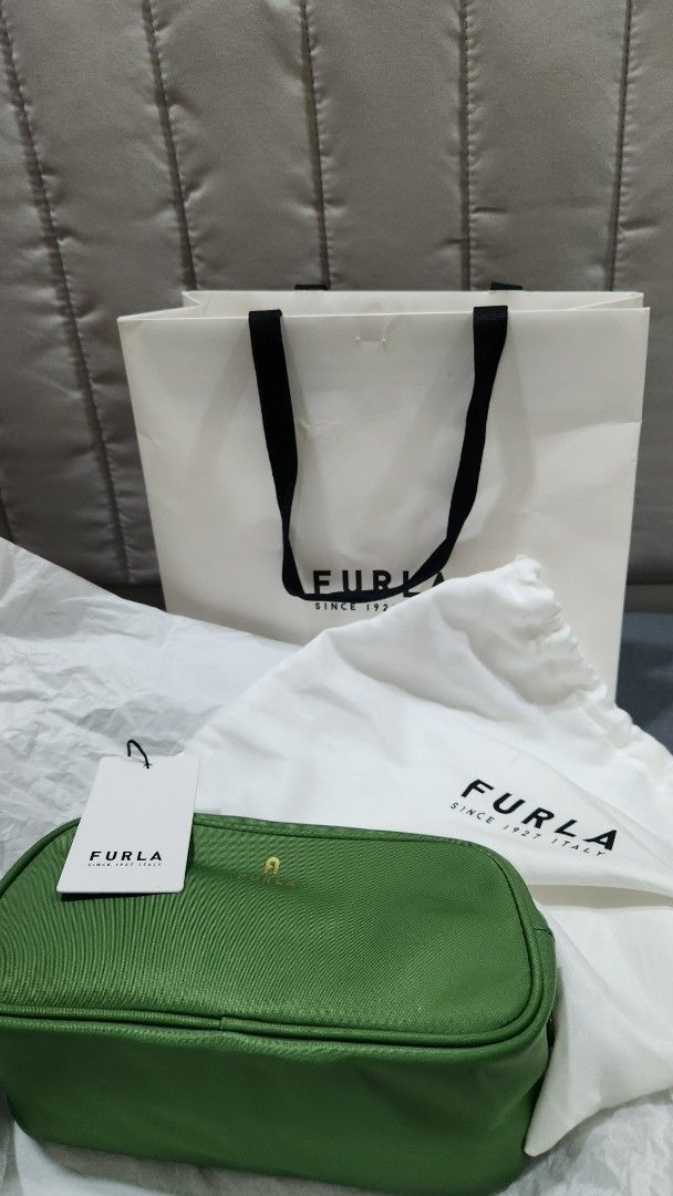 Furla Cosmetic Bag - Green (Category: Purses & Pouches) located in Manila. Submitted by summerstyled (Listing ID 1411538746, Image 2). Description: - Authentic Furla cosmetic bag - Color: Olive Green - Includes: Dust bag, shopping bag, and tag - Gold-colored Furla logo - Zipper closure - Perfect for makeup and small essentials - Stylish and practical accessory.