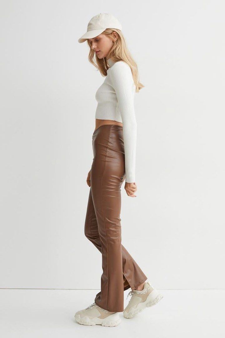 H&M Divided Faux Leather Pants (Category: Jeans) located in Bulacan. Submitted by eggydibs (Listing ID 1411471325, Image 1). Description: - H&M Divided faux leather pants - Color: Brown - Size: 4 - Style: High-waisted, flared - Features: Split hem - Material: Smooth faux leather.