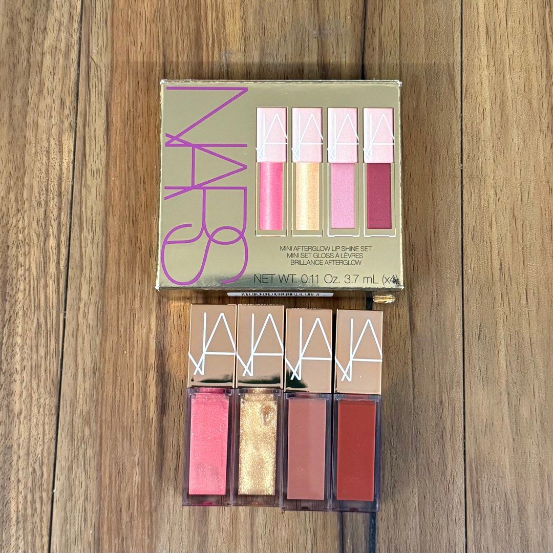 NARS Mini Afterglow Lip Shine Set (Category: Makeup) located in Quezon City. Submitted by glitznbits (Listing ID 1411482389, Image 1). Description: NARS’ Mini Afterglow Lip Shine Set is a secret we can’t *not* kiss and tell about. Boasting four universally flattering shades of the bestselling Afterglow Lip Shine in mini sizes, this kit showcases in ‘Orgasm’ a peachy pink with golden shimmer, ‘A-Lister’ clear with gold shimmer, ‘Nympho’ a cool tau