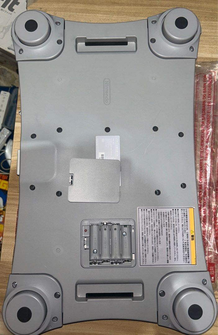 Nintendo Wii Balance Board (Category: Nintendo) located in Binalonan. Submitted by roncabacang (Listing ID 1411522876, Image 3). Description: - Nintendo Wii Balance Board included. - Comes with the original manual. - Requires 4 AA batteries (not included). - Features a power button and battery compartment. - White board with a gray underside. - Includes four feet. - Features the Nintendo logo. Original, tested and working. Clean battery compartme