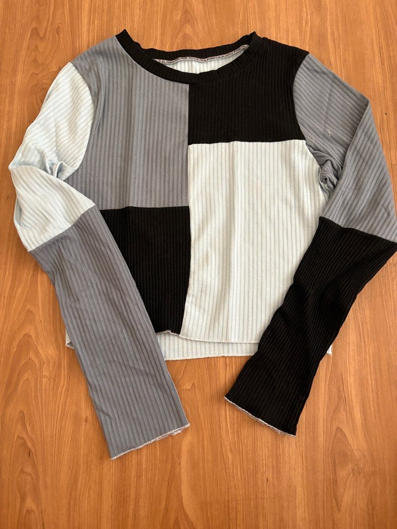 (no brand) blue long sleeve top (Category: Longsleeves) located in Manila. Submitted by maddsd_ (Listing ID 1411504370, Image 1). Description: - Long-sleeved top - Unique color block design - Ribbed texture - Round neckline - Cropped length - Raw hemline - Color scheme: Black, white, gray, and blue - Great with high-waisted bottoms.