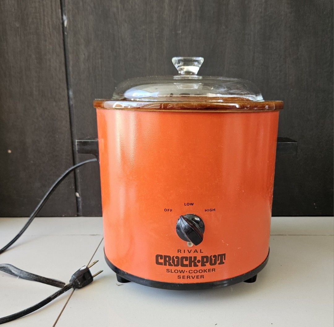 Rival Crock-Pot 3.5 Quart Slow Cooker 110v (Category: Cookers) located in Rizal. Submitted by cherry_garcia (Listing ID 1411556971, Image 2). Description: Vintage Rival Crock-Pot slow cooker. Features a 3.5-quart capacity. It has a glass lid and a dial with low, high, and off settings. The exterior is orange with black accents. Model number is 3100..