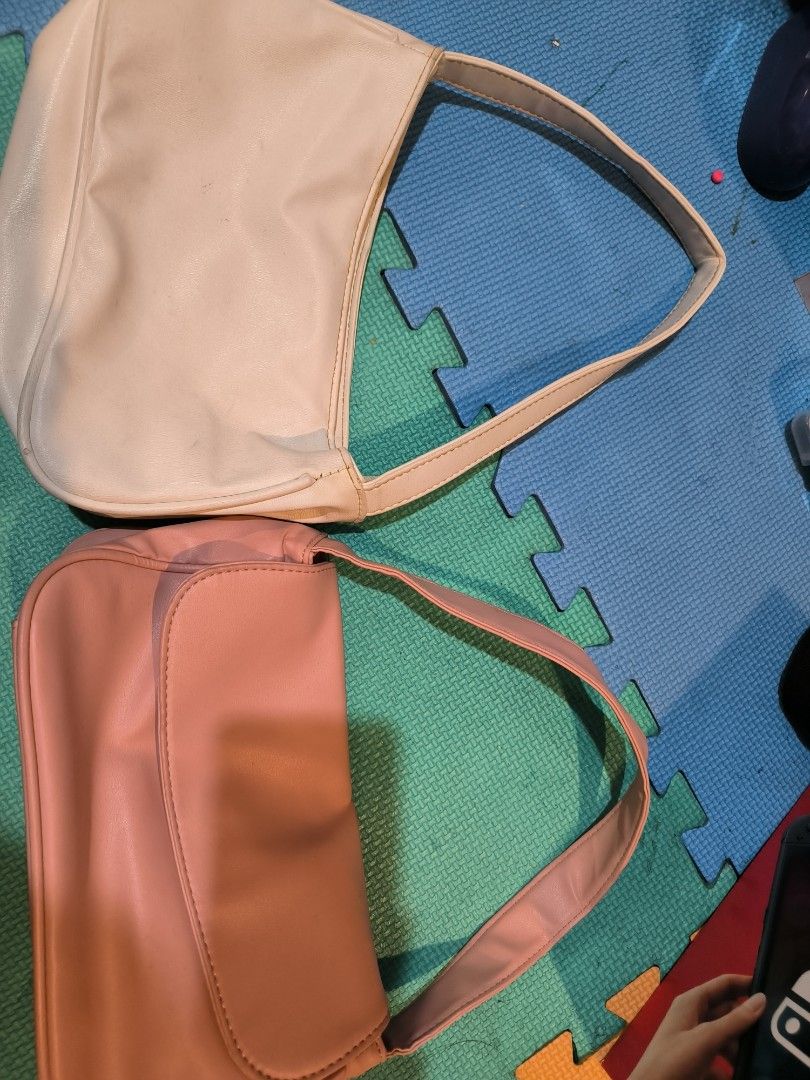 Shoulder Bag - Pink and White FOR FREE (Category: Shoulder Bags) located in Manila. Submitted by kimcath (Listing ID 1411598899, Image 2). Description: still in good condition! - Stylish shoulder bags in pink and white - Features a curved design - Single shoulder strap - Made of smooth material - Perfect for everyday or night use - Available in two colors Decluttering Shipping shouldered by miner.