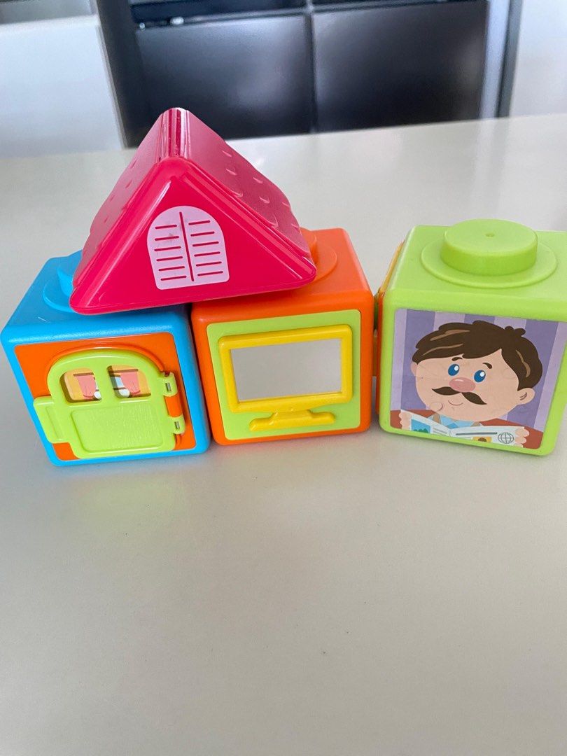Stackable Educational Toy Blocks (Category: Educational & Learning Toys) located in Singapore. Submitted by emit8 (Listing ID 1411510936, Image 1). Description: - Stackable blocks with pictures and shapes. - Develops fine motor skills. - Teaches shapes, colors, and everyday objects. - Easy to clean. - Safe for young children..