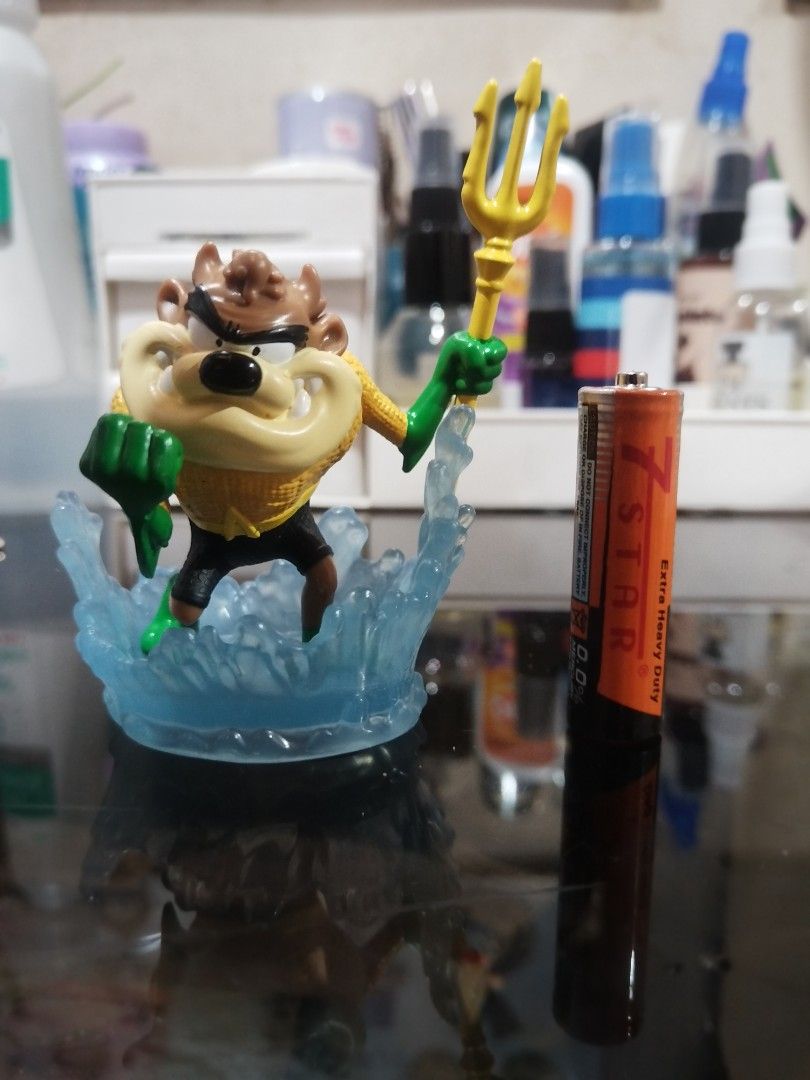 Tazmanian Devil Aquaman Figurine (Category: Figurines & Statues) located in Cavite. Submitted by jselvi (Listing ID 1411462831, Image 1). Description: - Tazmanian Devil as Aquaman figurine - Features the character holding a trident - Mounted on a blue water splash base - A fun and unique collectible - Size reference: 7 Star Extra Heavy Duty battery.