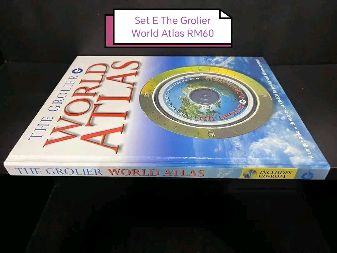 The Grolier World Atlas (Category: Textbooks) located in Manila. Submitted by betsybanayos (Listing ID 1411496471, Image 1). Description: - Grolier World Atlas with CD-ROM - Unique atlas - Price: RM60 - Title and brand visible on cover.
