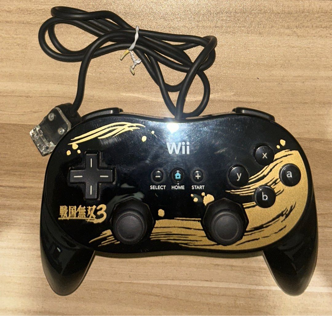 Wii Wired Controller (Samurai Warriors 3 ed) (Category: Controllers) located in Binalonan. Submitted by roncabacang (Listing ID 1411523457, Image 1). Description: - Wii wired controller - Black body with gold accents - Features D-pad, analog sticks, and action buttons - Wired connection for Wii console -Samurai Warriors 3 Edition Tested and working. Responsive buttons. Tight sticks. Meetup: Savemore Binalonan (Pangasinan) Shipping: via JnT or LBC