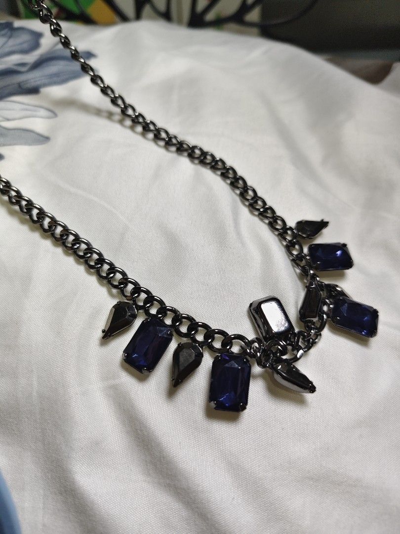 Blue sapphire gemstone pendant , black chain. (Category: Necklaces) located in San Mateo. Submitted by joryee (Listing ID 1411699266, Image 3). Description: -Japan surplus item -Good condition and still quality -the item chain is black -it has blue sapphire and black triangle pendants.