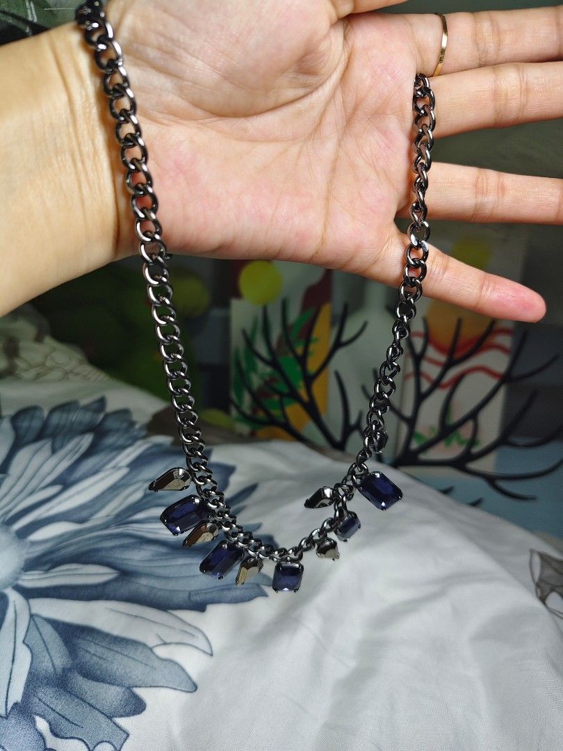 Blue sapphire gemstone pendant , black chain. (Category: Necklaces) located in San Mateo. Submitted by joryee (Listing ID 1411699266, Image 1). Description: -Japan surplus item -Good condition and still quality -the item chain is black -it has blue sapphire and black triangle pendants.