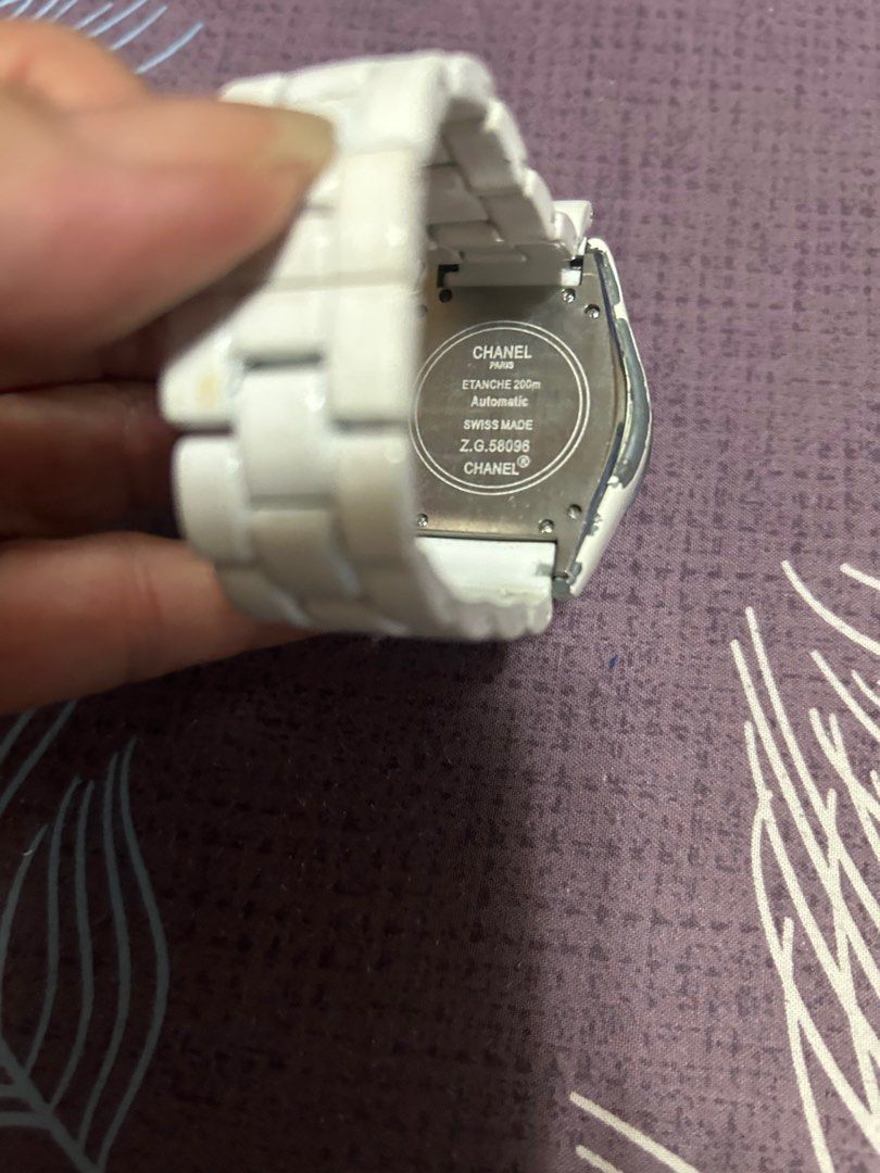 Chanel J12 Automatic Chronograph Watch (Category: Luxury Watches) located in Manila. Submitted by sakuranohana (Listing ID 1411664692, Image 3). Description: Chanel J12 Chronograph H1007 White Ceramic Z.G. 58096 Made in Switzerland Original watch No box unit only With scratches on ceramic chips Glass no damage Discolorated button This unit is personal use Didnt know the year model..