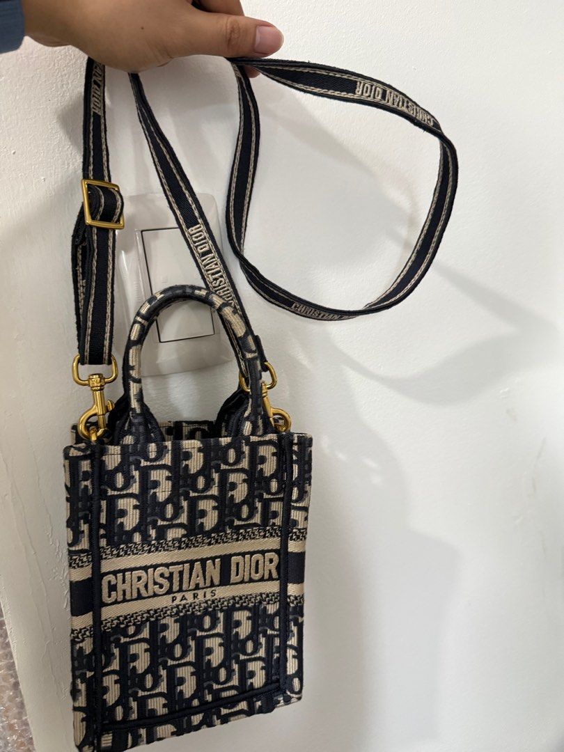 Christian Dior Book Tote Mini Bag (Category: Luxury Bags & Wallets) located in Makati City. Submitted by skyhigh_777 (Listing ID 1411713860, Image 1). Description: - Dior Mini Book Tote - Blue Dior Oblique jacquard - Removable shoulder strap with "Christian Dior" lettering - Top handles - Spacious interior - Versatile and stylish - Perfect for carrying essentials - Suitable for various occasions Bought from HK. Authenticity cant guarantee. .