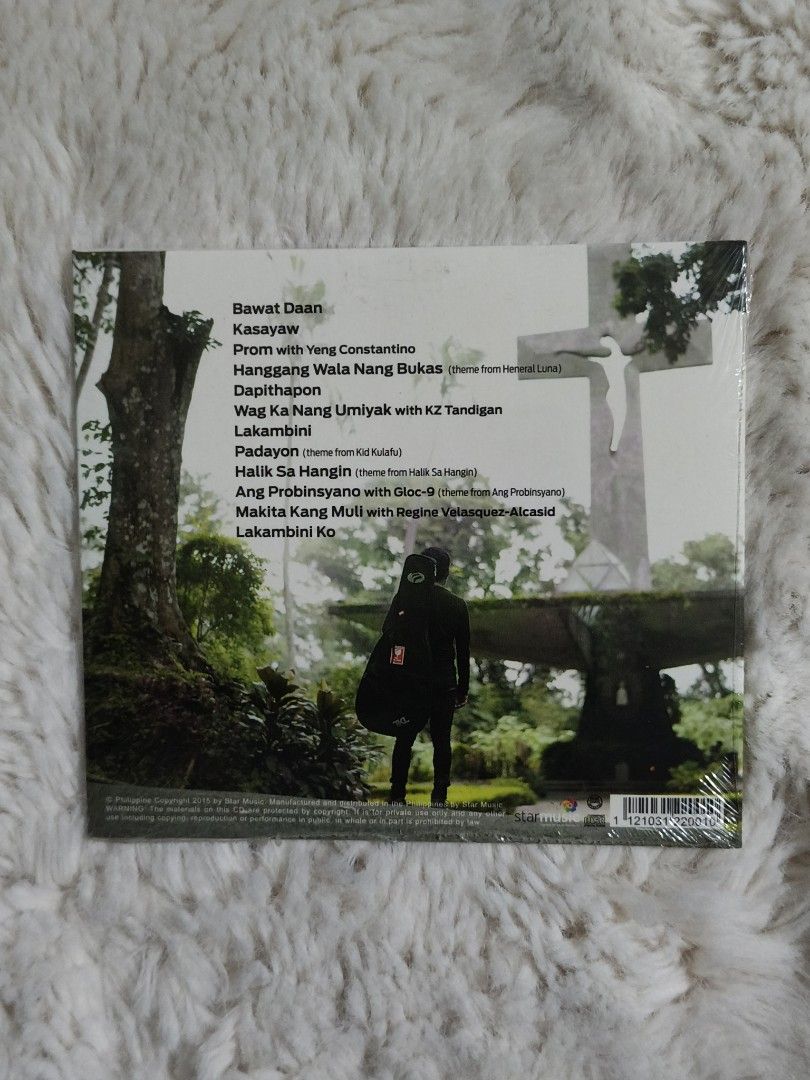 Ebe Dancel - Bawat Daan CD (Category: CDs & DVDs) located in Quezon City. Submitted by kevinfuentes0219 (Listing ID 1411761988, Image 2). Description: Original CD album by Ebe Dancel, titled "Bawat Daan". The album includes tracks like "Bawat Daan", "Kasayaw", "Prom with Yeng Constantino", and more. The CD is still sealed in its original packaging..