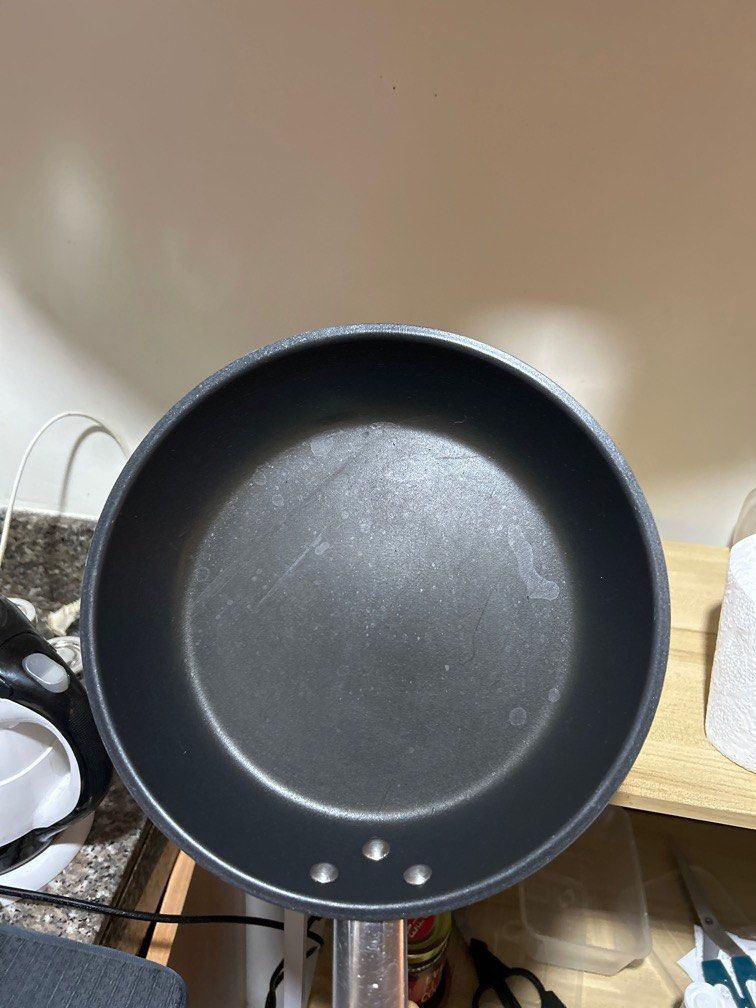 IKEA Non-Stick Induction Frying Pan (Category: Cookware & Accessories) located in Makati City. Submitted by katrinavalle (Listing ID 1411741983, Image 2). Description: - Non-stick frying pan - Long, sturdy handle for easy handling - Dark-colored pan - Glass-center lid with black handle - Suitable for various cooking needs - Ready to use.