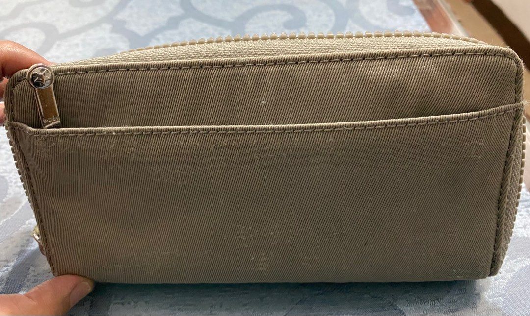 Kipling RFID Safe Wallet (Category: Wallets & Card holders) located in Cagayan de Oro. Submitted by cu_2022 (Listing ID 1411772519, Image 3). Description: - Kipling wallet with secure zip-around closure. - Multiple compartments and card slots for organization. - Includes a convenient wrist strap. - Features RFID protection for added security. - Interior zippered pocket for coins and small items. - Authentic Kipling design with the iconic logo..