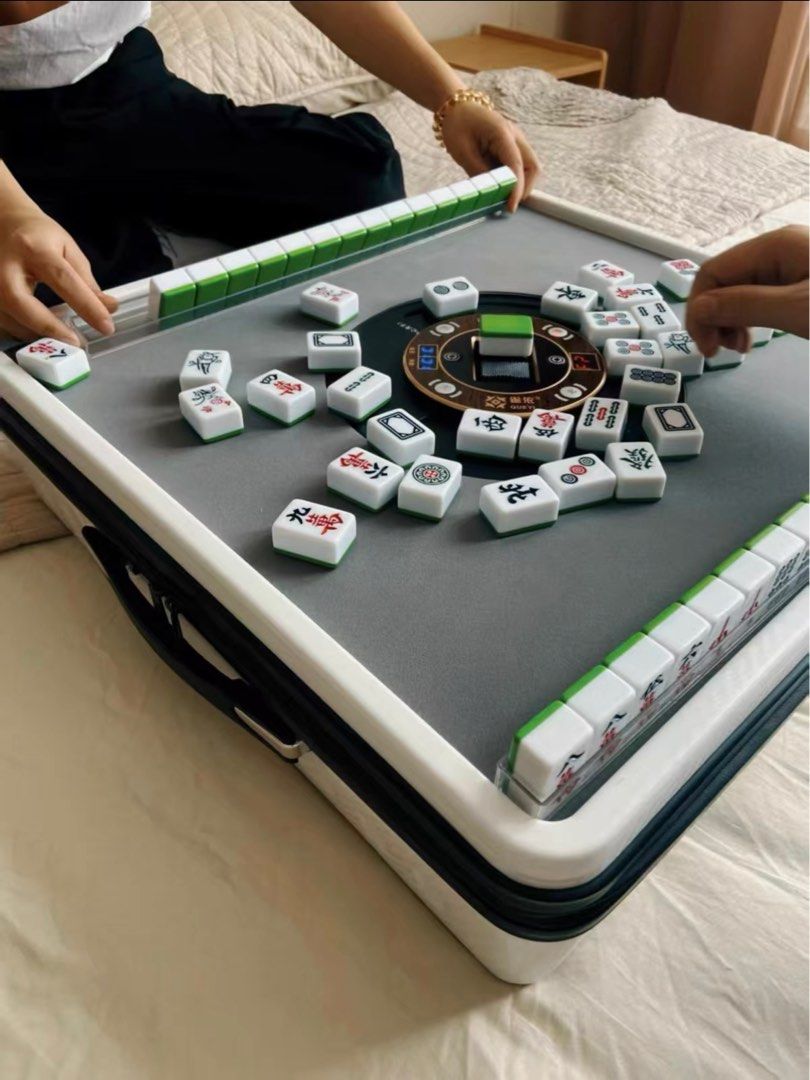 Portable Mini Automatic Mahjong Table (Category: Board Games & Puzzles) located in Mandaluyong City. Submitted by jenerously (Listing ID 1411756761, Image 1). Description: *Can use via power bank that can last for 10 hours or plug it directly * 1 set of tiles( 144) *Brand new *Very handy *Total of 15 kgs in total *Pre- order (1 week to wait) *Color available: pink, white and black.