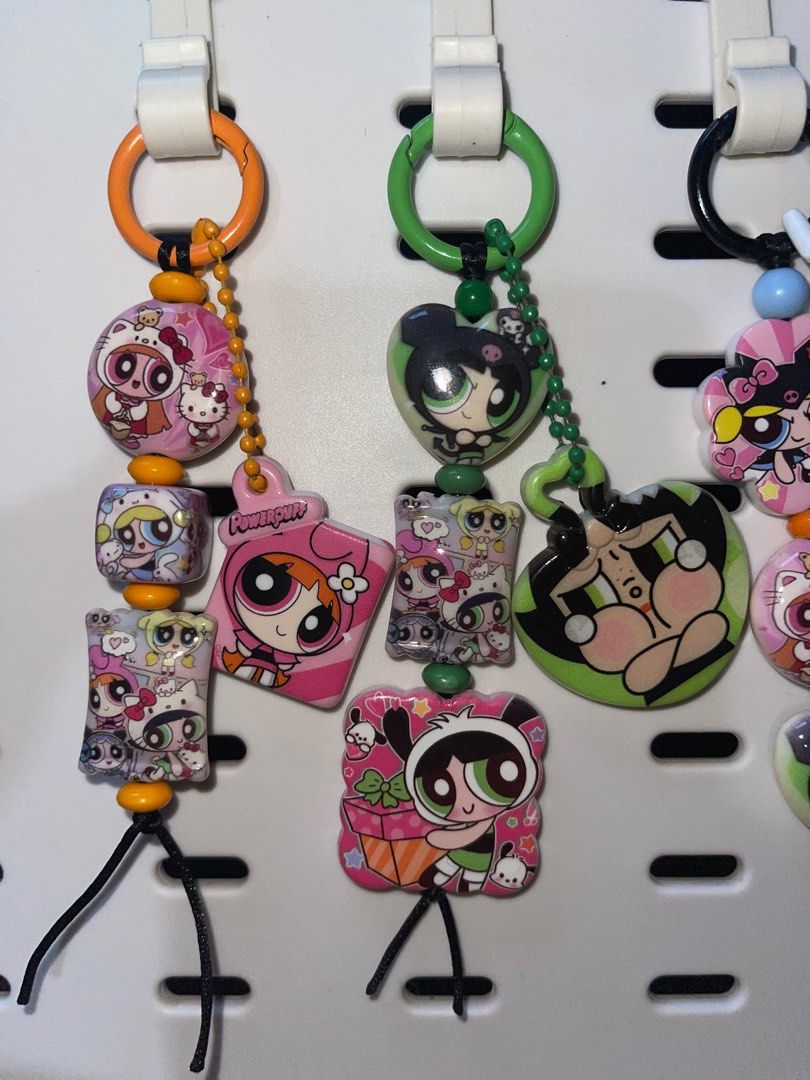 Powerpuff Girls Keychains (Category: Character Goods) located in Pinamalayan. Submitted by bookscaped (Listing ID 1411699291, Image 2). Description: - Powerpuff Girls keychains featuring Blossom, Bubbles, and Buttercup. - Each keychain has a unique design. - Adorned with beads and charms. - Perfect for keys, bags, and accessories. - A must-have for Powerpuff Girls fans!.