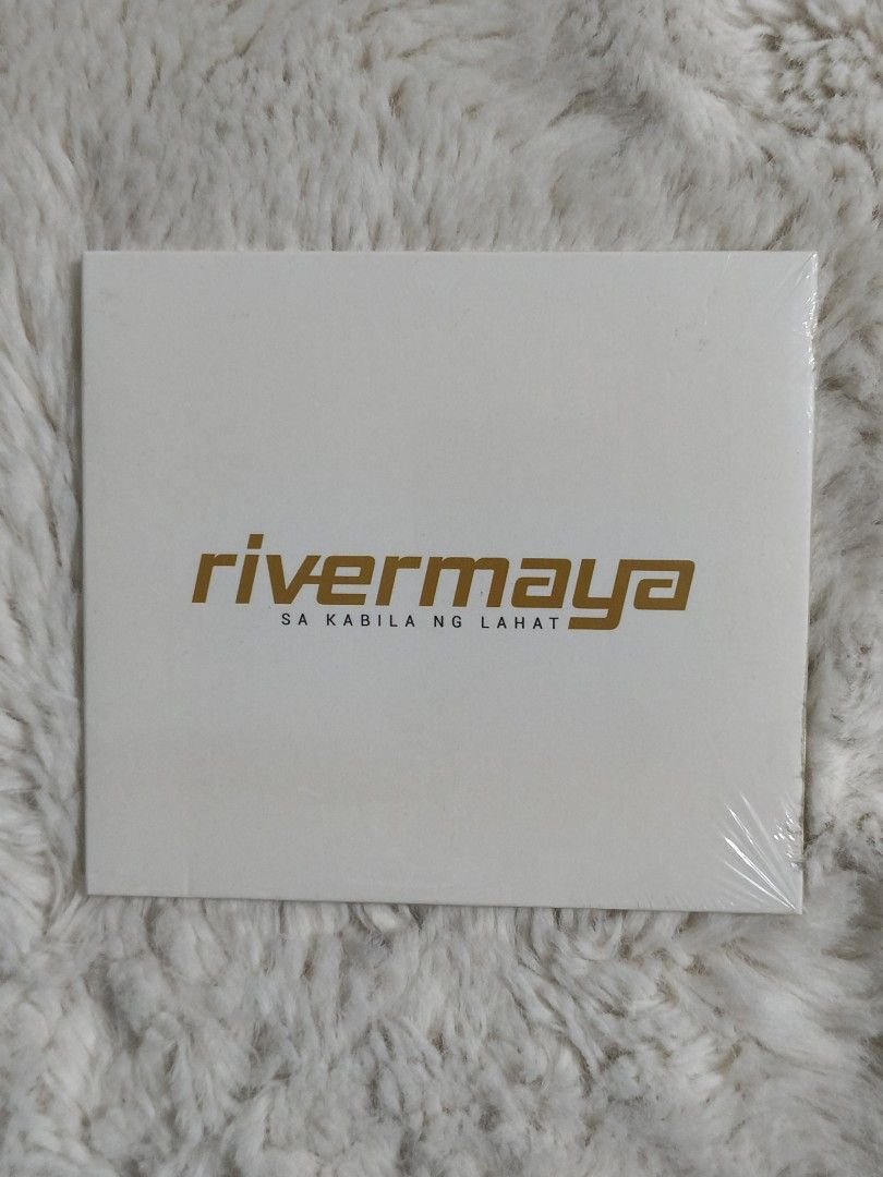 Rivermaya Sa Kabila Ng Lahat CD (Category: CDs & DVDs) located in Quezon City. Submitted by kevinfuentes0219 (Listing ID 1411762304, Image 1). Description: Original Rivermaya "Sa Kabila Ng Lahat" CD. Features tracks like "Manila", "8 to 5", and "Sana Ikaw Nalang". The CD is still sealed in its original packaging. Includes the band members' photo on the back cover. A must-have for Rivermaya fans..
