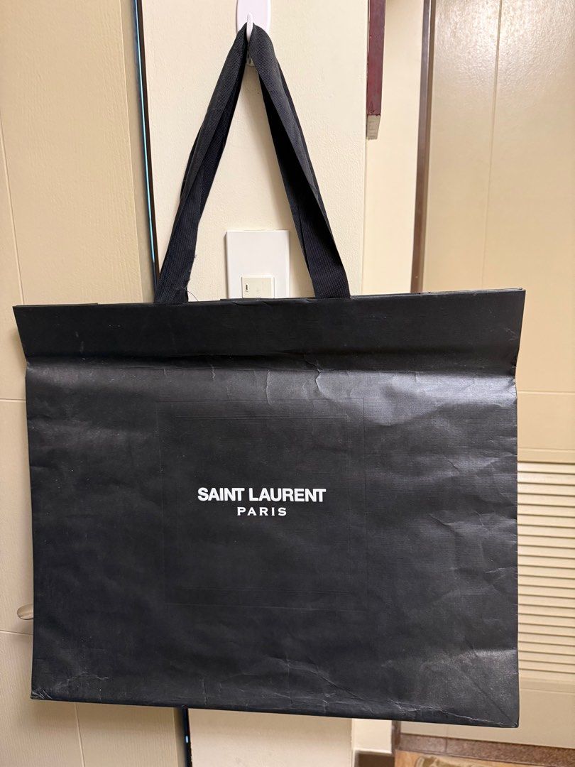 Saint Laurent XL paper Bag (Category: Looking For) located in Pasig City. Submitted by davedeleon (Listing ID 1411708199, Image 1). Description: Original Saint Laurent paper bag Size: W 22" x H 18.5" No issues No trade Price excludes SF.