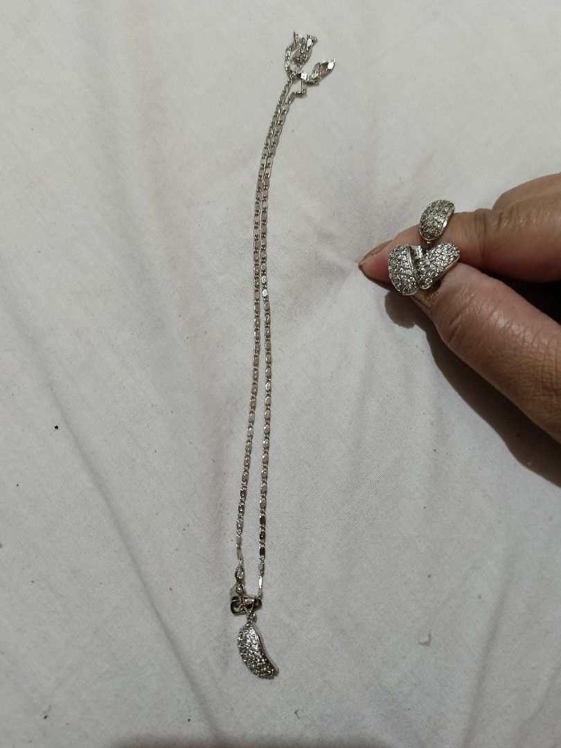 Silver Necklace with Pendant and Butterfly Ring (Category: Necklaces) located in Pandi. Submitted by rizzahermo03052 (Listing ID 1411630319, Image 1). Description: - sterlingSilver necklace and butterfly ring set - Necklace: - Delicate chain - Pendant with sparkling embellishments - Ring: - Butterfly design - Sparkling embellishments - Beautiful set for any occasion -avon .