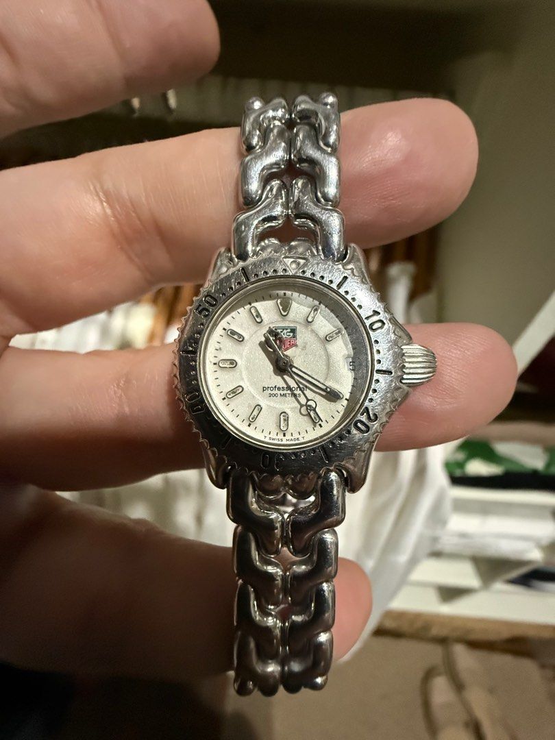 TAG Heuer Professional 200m Watch (Category: Luxury Watches) located in Dumaguete. Submitted by thethingsiloved. (Listing ID 1411753671, Image 1). Description: - TAG Heuer Professional watch - Silver-toned bracelet - White dial - Rotating bezel - Date display - Water resistant to 200m - Sapphire crystal - TAG Heuer clasp.