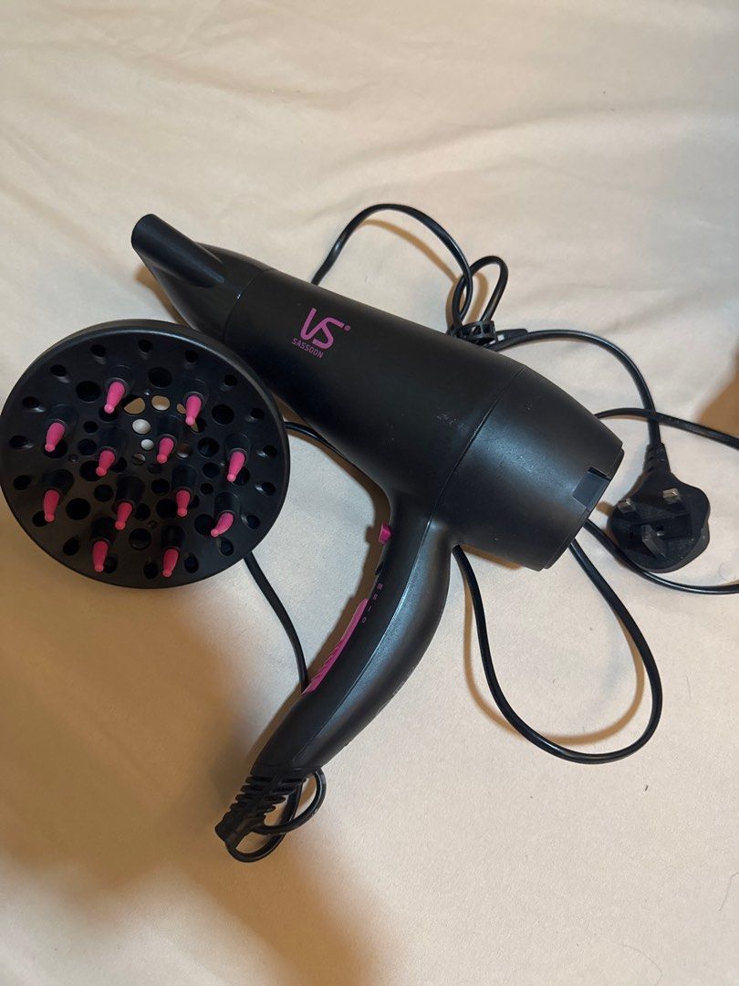 VS Sassoon Hair Dryer with Diffuser (Category: Hair) located in Makati City. Submitted by closetcleanup_things (Listing ID 1411709856, Image 1). Description: - VS Sassoon hair dryer with pink accent - Includes diffuser attachment - Multiple heat and speed settings - Standard plug - In good working condition.