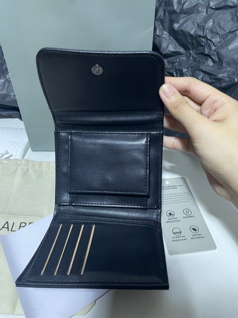 Alberto Unisex Black Wallet (Category: Luxury Bags & Wallets) located in Manila. Submitted by yanggggggie (Listing ID 1411796958, Image 3). Description: - Like brand new - Used twice - With paperbag, tags - RFS: i received new gift wallet.
