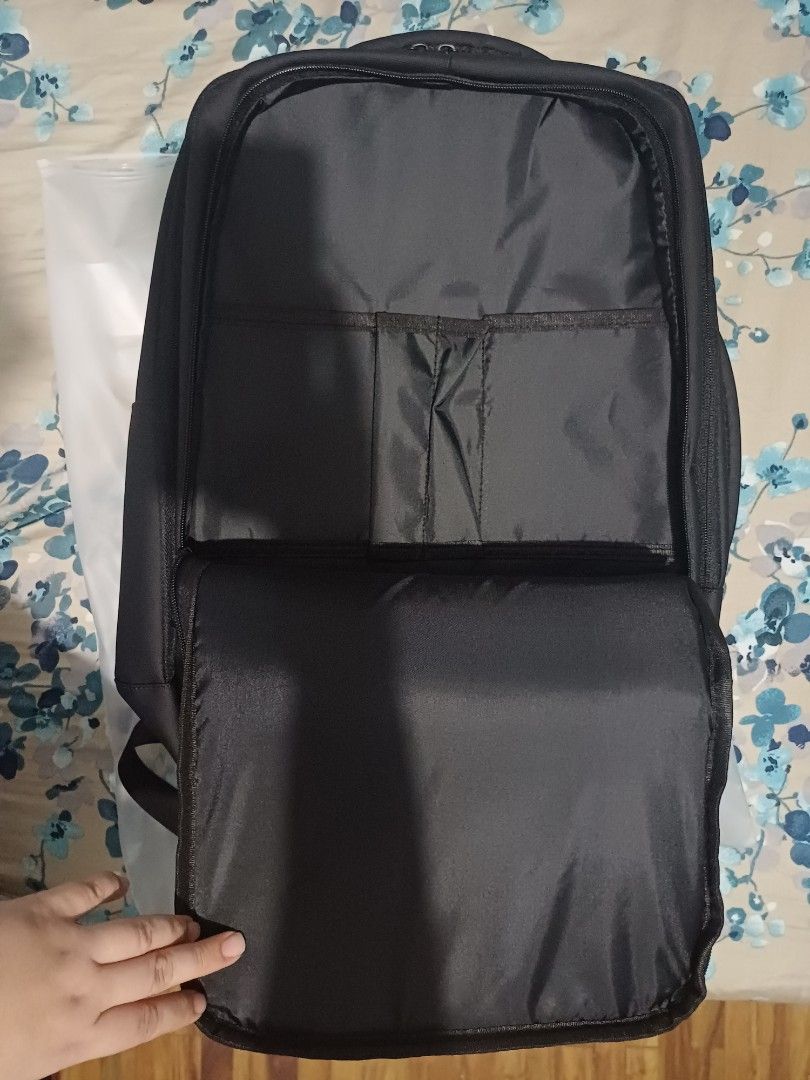 Black Laptop Backpack with USB Charging Port (Category: Backpacks) located in Muntinlupa City. Submitted by joyrose (Listing ID 1411866750, Image 3). Description: - Black backpack - Multiple compartments for organized storage - Dedicated laptop compartment - USB charging port - Padded shoulder straps - Top and side handles - Durable, water-resistant material - Interior pockets for small items.