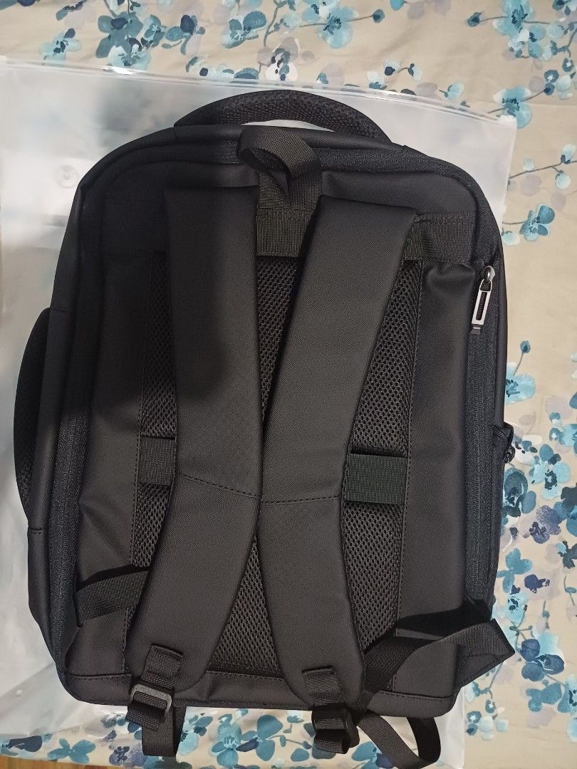 Black Laptop Backpack with USB Charging Port (Category: Backpacks) located in Muntinlupa City. Submitted by joyrose (Listing ID 1411866750, Image 2). Description: - Black backpack - Multiple compartments for organized storage - Dedicated laptop compartment - USB charging port - Padded shoulder straps - Top and side handles - Durable, water-resistant material - Interior pockets for small items.