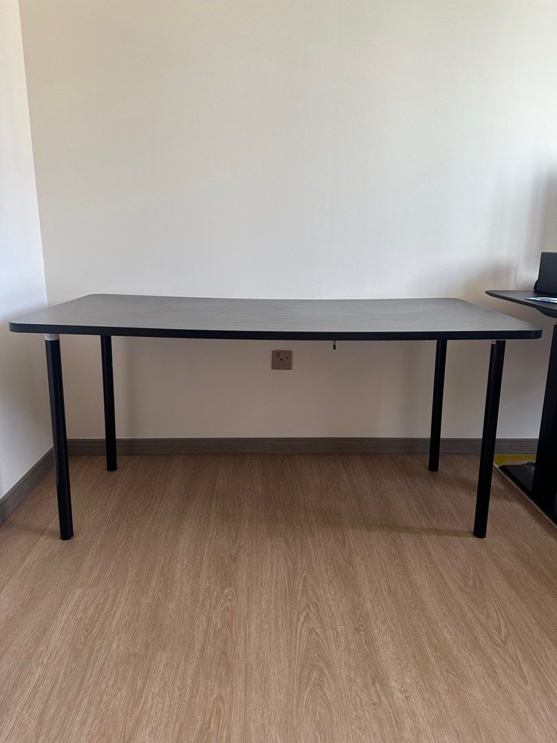 Black Rectangular Table (Category: Tables & Sets) located in Singapore. Submitted by kinbap (Listing ID 1411819912, Image 1). Description: - Stylish black rectangular table - Perfect for home office or study - Sleek design with black legs and smooth tabletop - 1.6m x 75cm x 70 cm - Ready for immediate use - Great for work or leisure.
