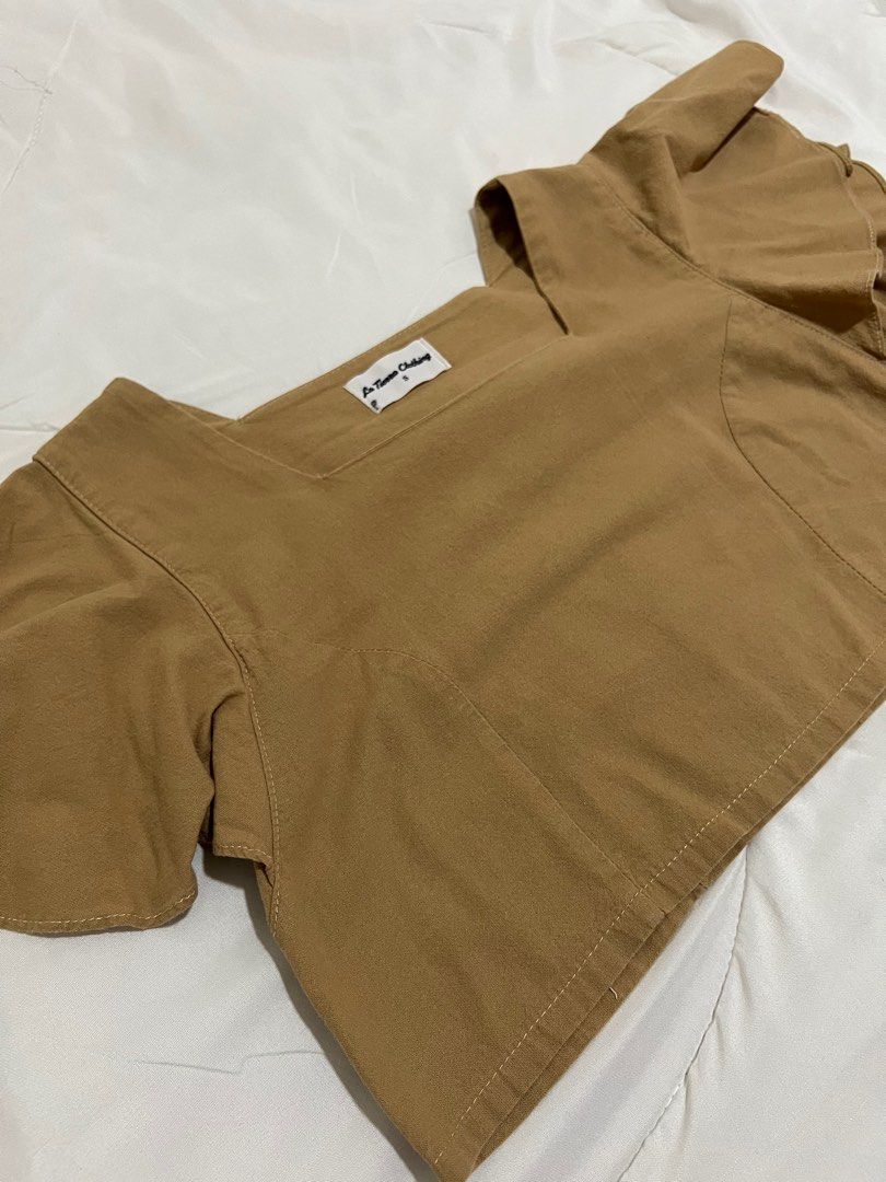 Brown cropped top (Category: Blouses) located in Quezon City. Submitted by katedeclutter (Listing ID 1411798184, Image 2). Description: - Color: Tan - Size: XS-S.