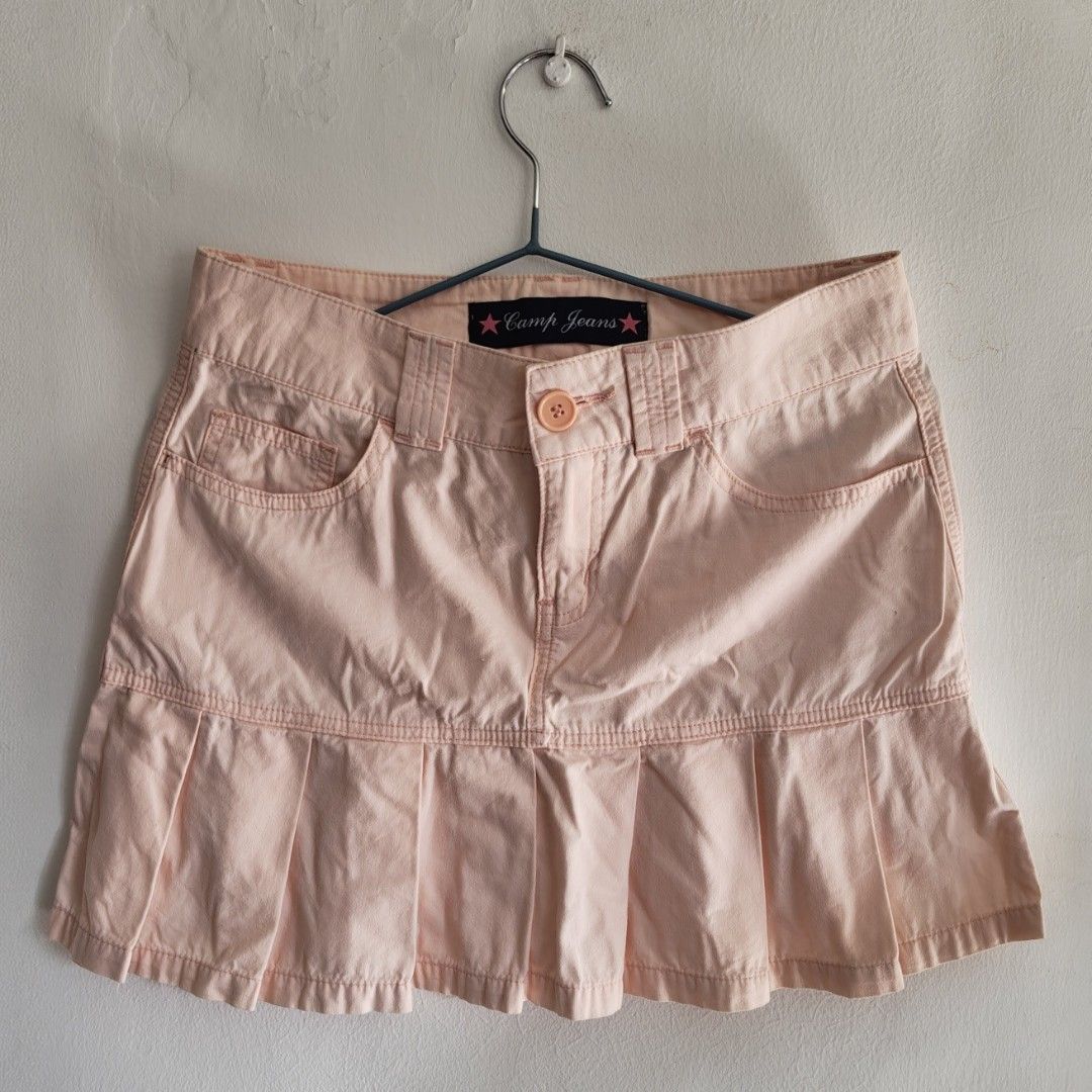 Camp Jeans Pleated Mini Skirt (Category: Skirts) located in Imus. Submitted by decluttering_millennial (Listing ID 1411872908, Image 1). Description: - Camp Jeans mini skirt - Light pink - Size 27 - Pleated hem, front and back pockets, button closure and belt loops - Very Y2K; easy to pair skirt with other tops.