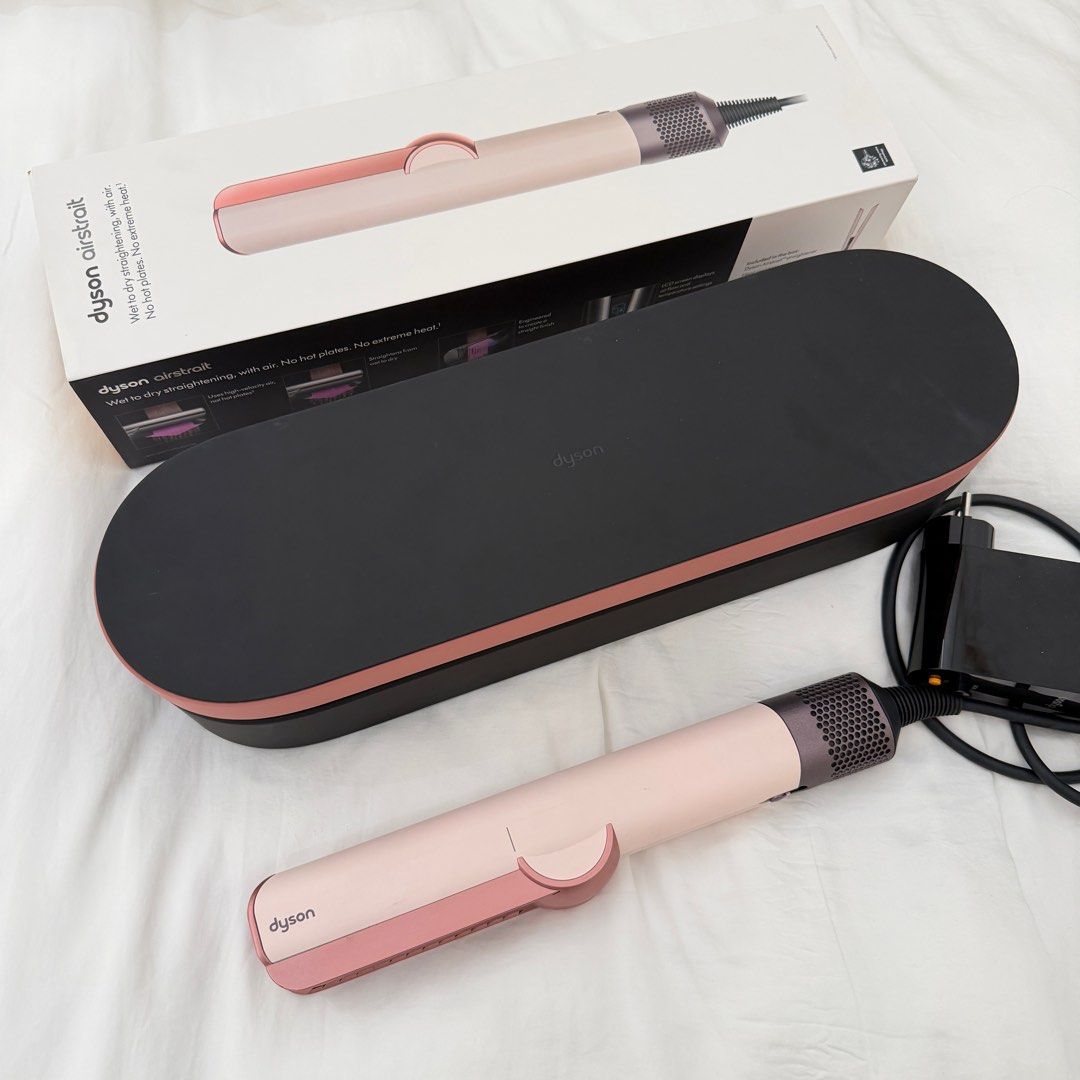 Dyson AirStrait Hair Straightener (Category: Hair) located in Manila. Submitted by iamtrustworthy (Listing ID 1411942321, Image 1). Description: - Dyson AirStrait hair straightener - Color: Ceramic Pink - Straightens hair while wet - Uses air, not extreme heat - Includes storage case - Comes with original box.