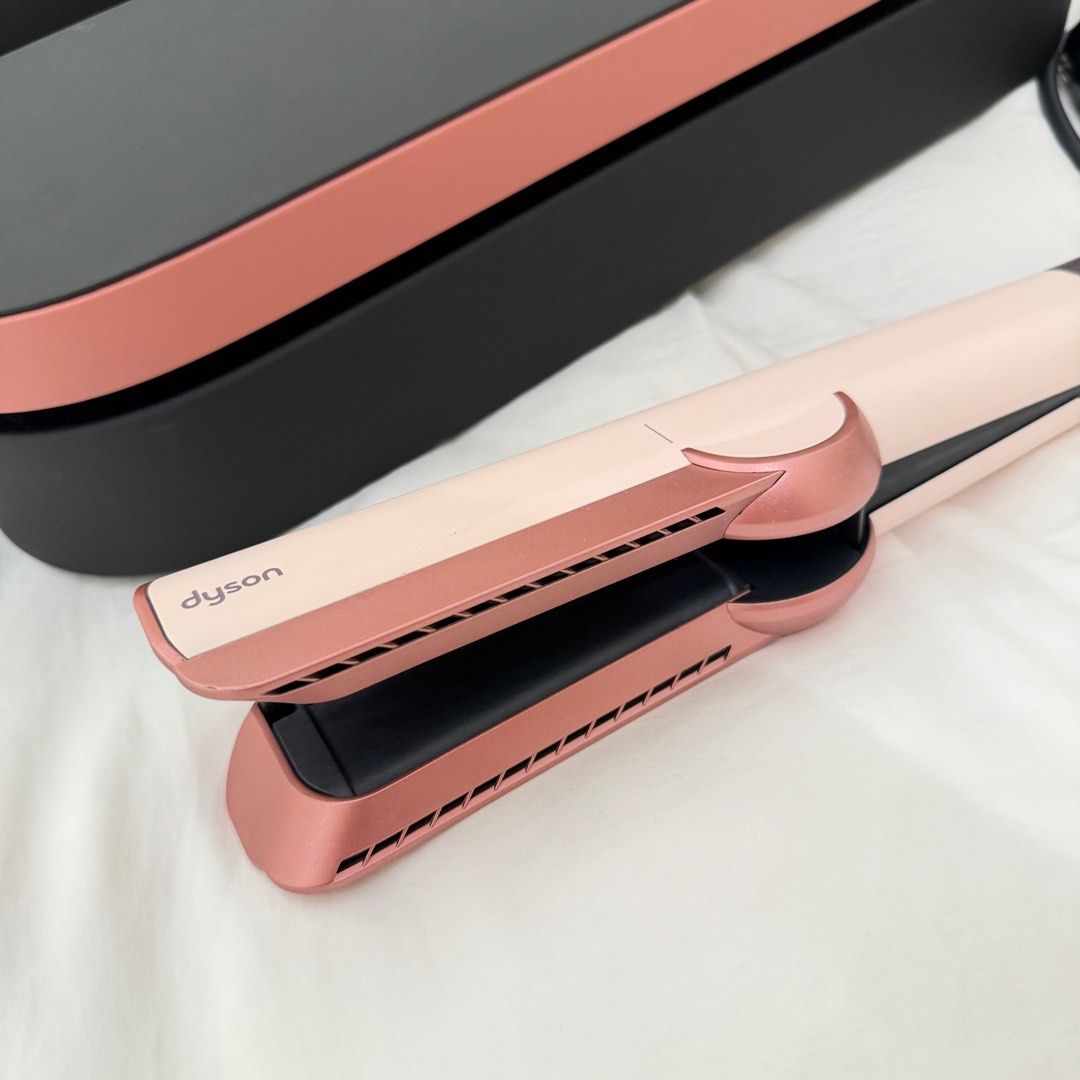Dyson AirStrait Hair Straightener (Category: Hair) located in Manila. Submitted by iamtrustworthy (Listing ID 1411942321, Image 2). Description: - Dyson AirStrait hair straightener - Color: Ceramic Pink - Straightens hair while wet - Uses air, not extreme heat - Includes storage case - Comes with original box.