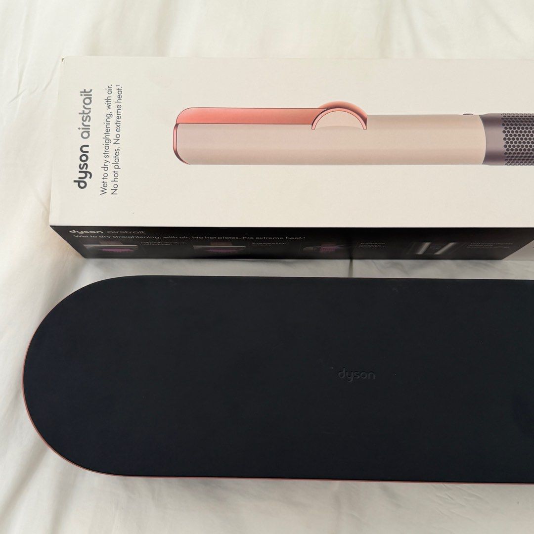 Dyson AirStrait Hair Straightener (Category: Hair) located in Manila. Submitted by iamtrustworthy (Listing ID 1411942321, Image 3). Description: - Dyson AirStrait hair straightener - Color: Ceramic Pink - Straightens hair while wet - Uses air, not extreme heat - Includes storage case - Comes with original box.