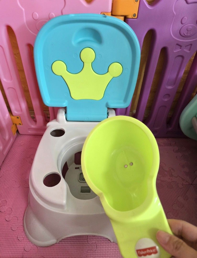 Fisherprice Royal Stepstool Potty (Category: Toilet Training) located in Quezon City. Submitted by lorenandi (Listing ID 1411926569, Image 2). Description: ♡ Original retail price: P1,600 ♡ Dimensions (cm): 21 x 35 x 35 ♡ Plays 4 Royal Tunes ♡ Built in splash guard for boys ♡ Lid folds down to convert to a sturdy stepstool for kids up to 200lbs (90kg) ♡ With removable bowl for easy clean-up.