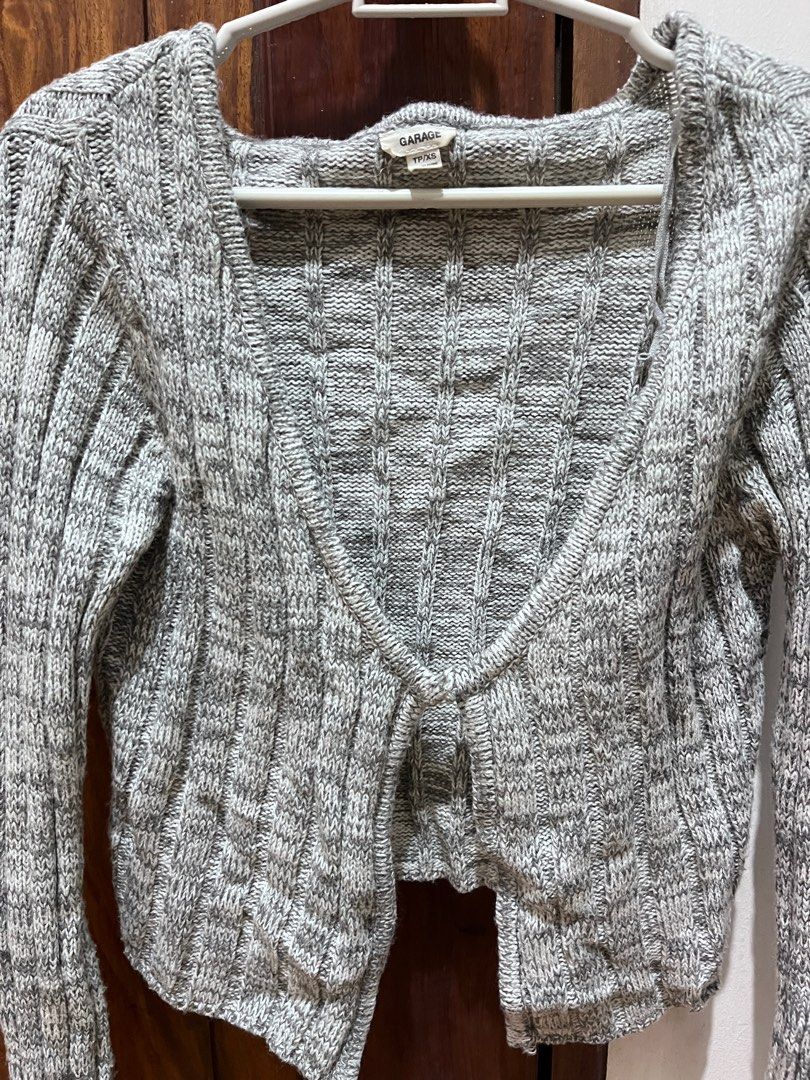 Garage Gray Knit Cardigan (Category: Coats, Jackets and Outerwear) located in Taguig. Submitted by pau76 (Listing ID 1411944311, Image 2). Description: - Garage gray knit cardigan - Size: XS - S - Features a V-neck - Long sleeves - Hook closure - Ribbed texture - Perfect for layering Message for more info/pictures..