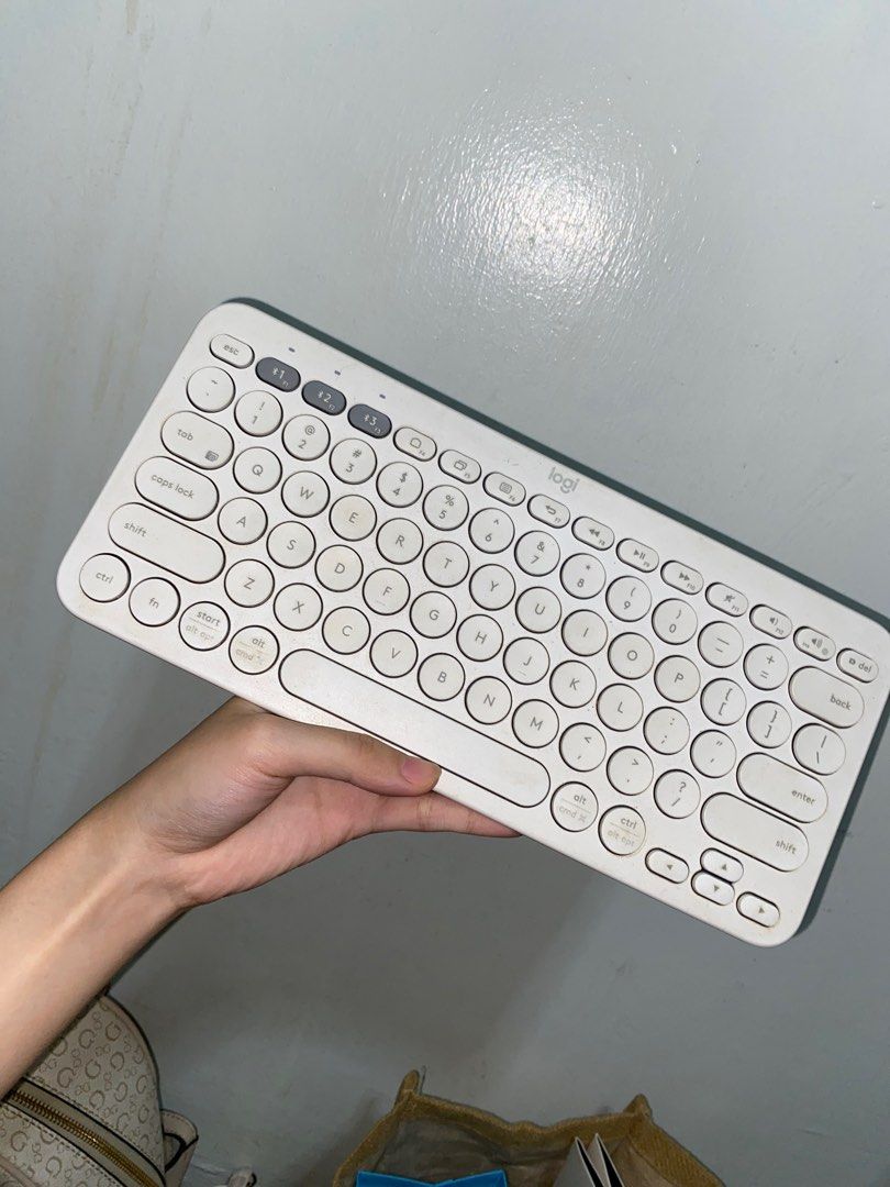 Logitech K380 Wireless Keyboard (Category: Computer Keyboard) located in Marikina City. Submitted by kristiiinee (Listing ID 1411886529, Image 1). Description: - Logitech K380 wireless keyboard - White color - Compact design with round keys - Standard QWERTY layout - Features function keys and power button.