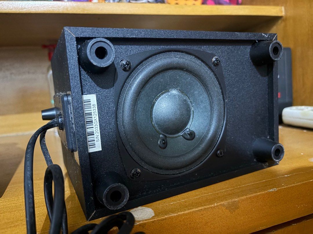 Logitech Z213 Compact Speaker System with Subwoofer (Category: Soundbars, Speakers & Amplifiers) located in Dasmarinas. Submitted by hopefullyyoursph (Listing ID 1411879171, Image 3). Description: Logitech speaker system with a subwoofer. - Includes two satellite speakers and a subwoofer unit. - has volume control knob and various input/output ports. - has a rear-facing port and a bottom-facing speaker - wired / jack - Color: Black - Brand: Logit