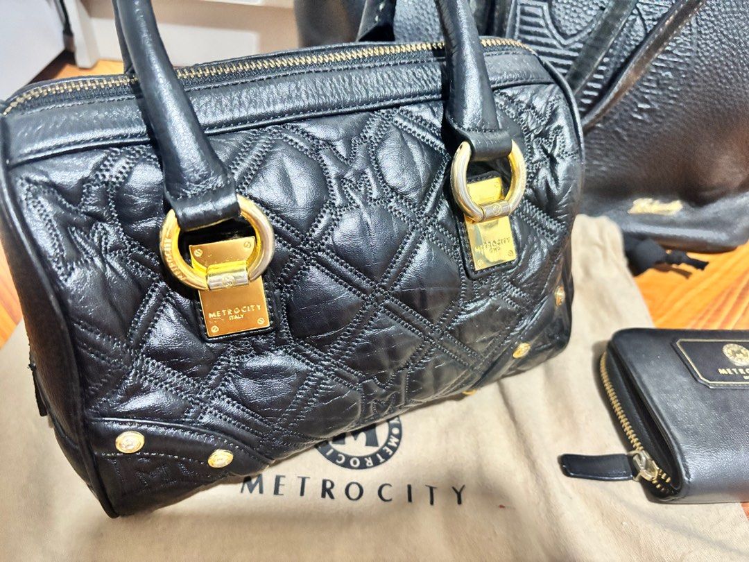 Metrocity Bags & Wallet bundle (Category: Luxury Bags & Wallets) located in Malabon City. Submitted by marionettes (Listing ID 1411934807, Image 3). Description: - Metrocity Handbag: Black, quilted design with gold-tone hardware. - Metrocity Tote Bag: Spacious interior. - Metrocity Wallet: Compact black design with zipper closure. - All items are authentic Metrocity .
