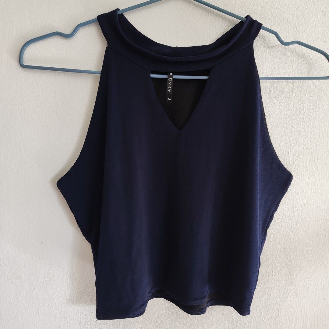Navy Blue Halter Blouse (Category: Sleeveless) located in Imus. Submitted by decluttering_millennial (Listing ID 1411870999, Image 2). Description: - Navy blue halter top - Keyhole detail - Size M - Stretchable, comfy material - Sleeveless design - Black lining - Suitable for casual wear.