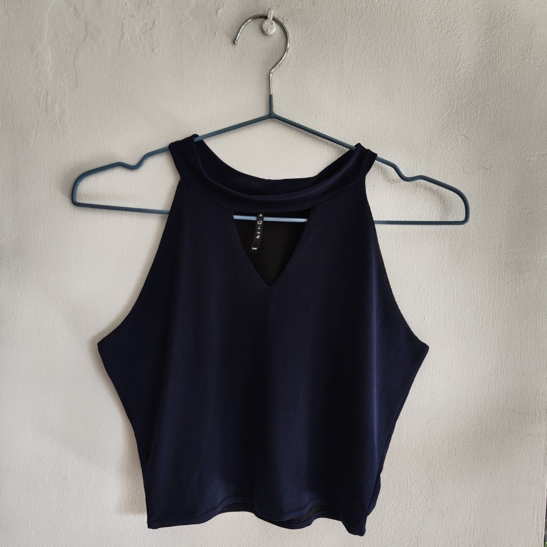 Navy Blue Halter Blouse (Category: Sleeveless) located in Imus. Submitted by decluttering_millennial (Listing ID 1411870999, Image 1). Description: - Navy blue halter top - Keyhole detail - Size M - Stretchable, comfy material - Sleeveless design - Black lining - Suitable for casual wear.